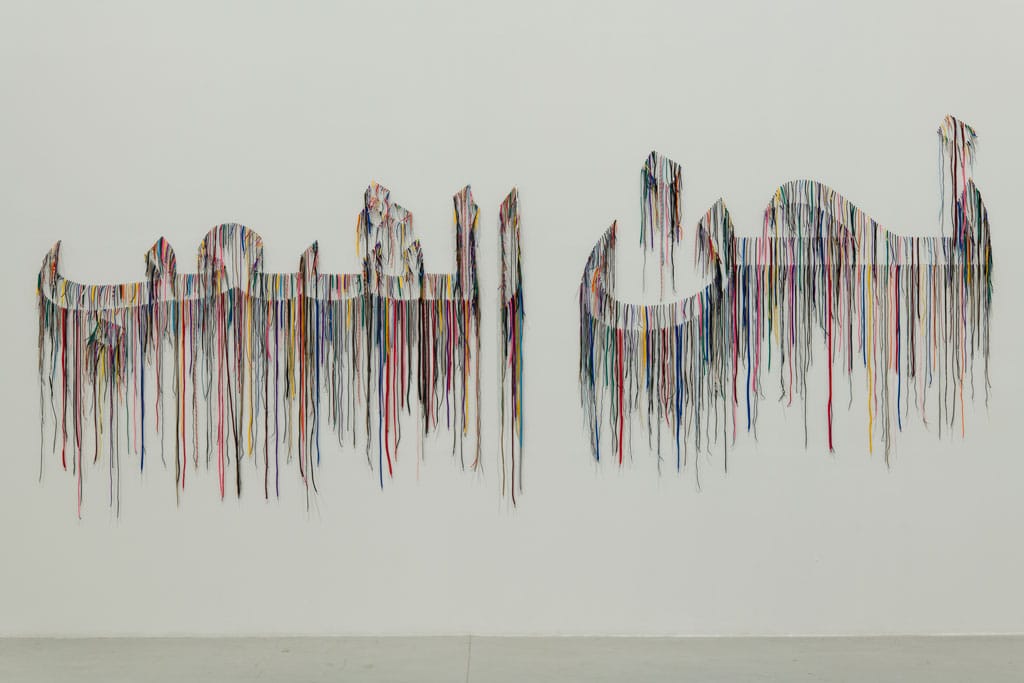Nari Ward. We the People (Arabic Version), 2018, Shoelaces; 570 x 230 cm, © Sharjah Art Foundation Collection. Photo: Danko Stjepanovic